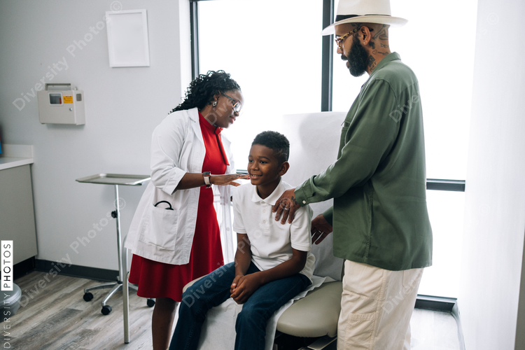 Black pediatrician does strength examination doctor patient consultation