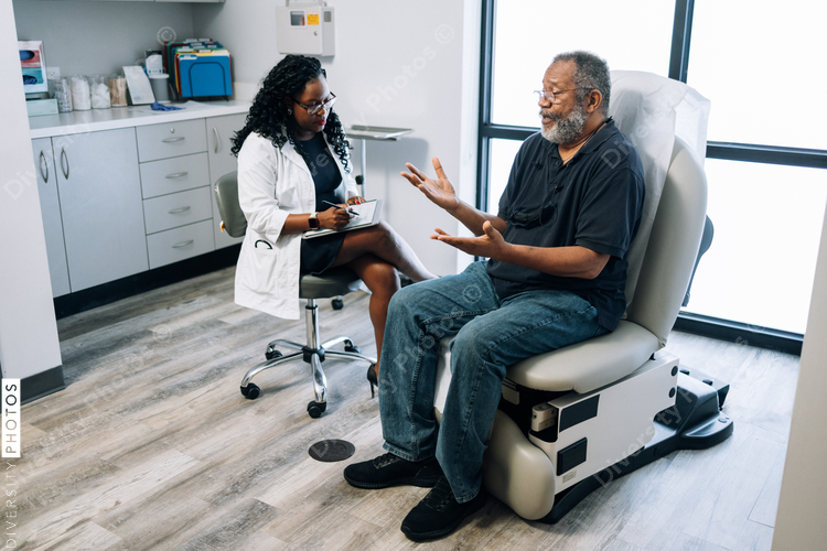 Doctor consulting African American man