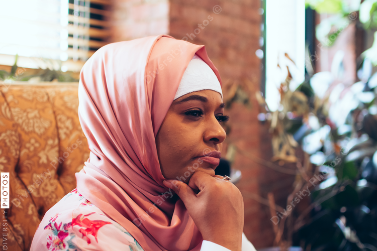 Close up of thoughtful woman sitting on chair