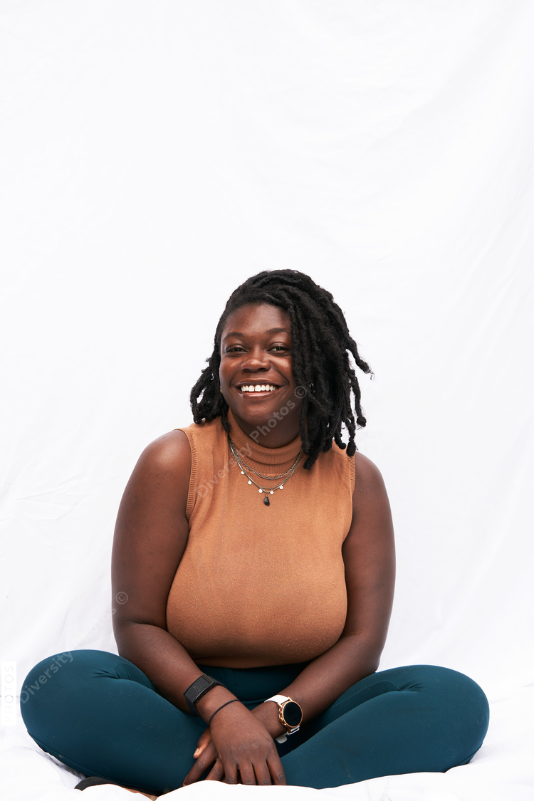 Portrait smiling plus size Black woman with locs
