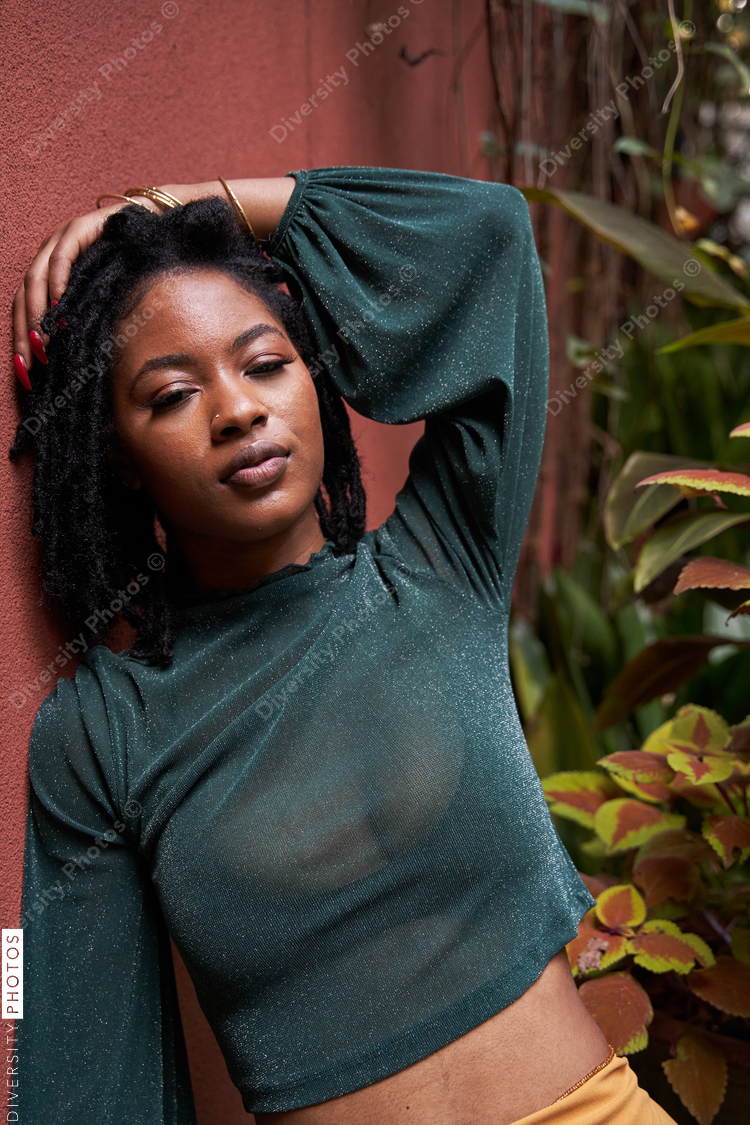 Portrait of young Black woman in garden, plants and nature
