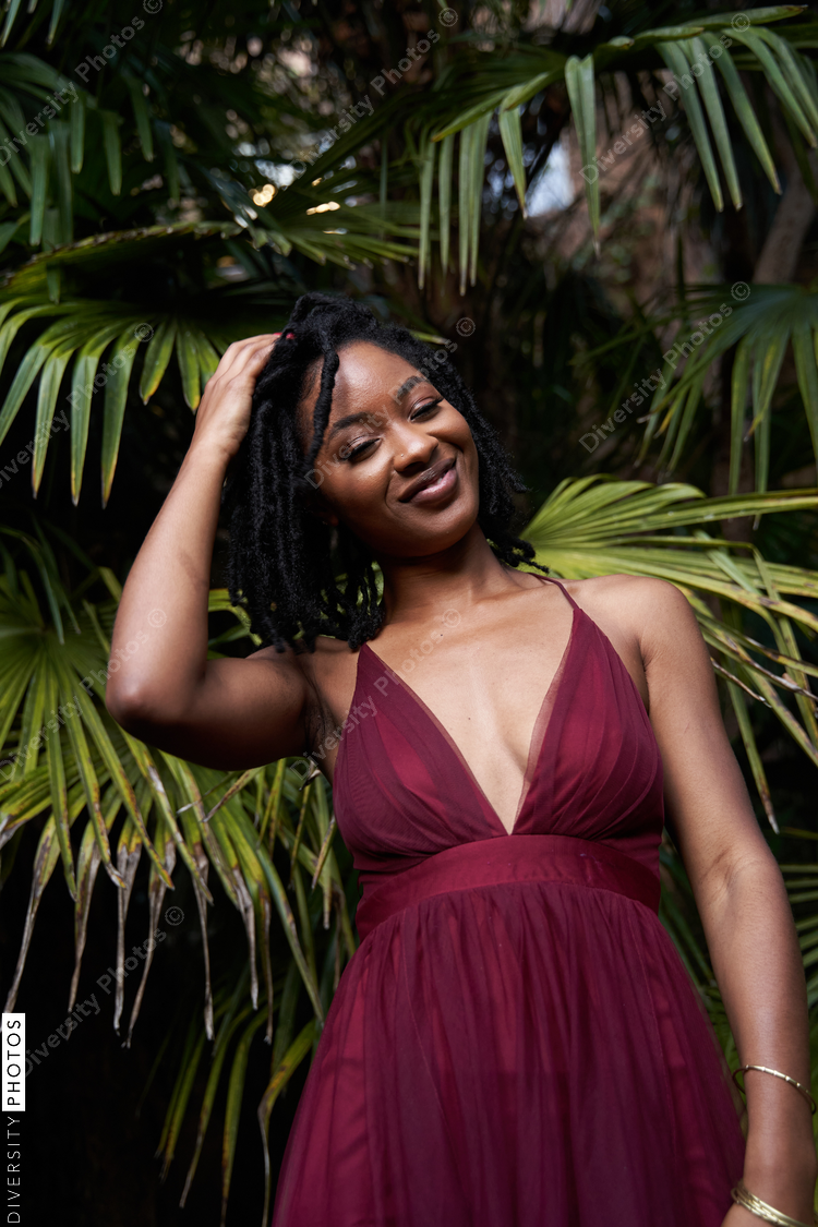 Portrait of African American woman with plants