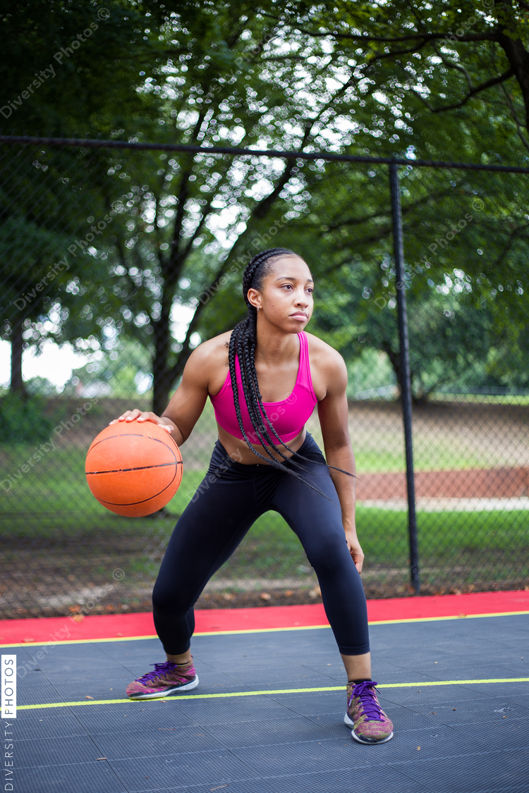 Women playing basketball