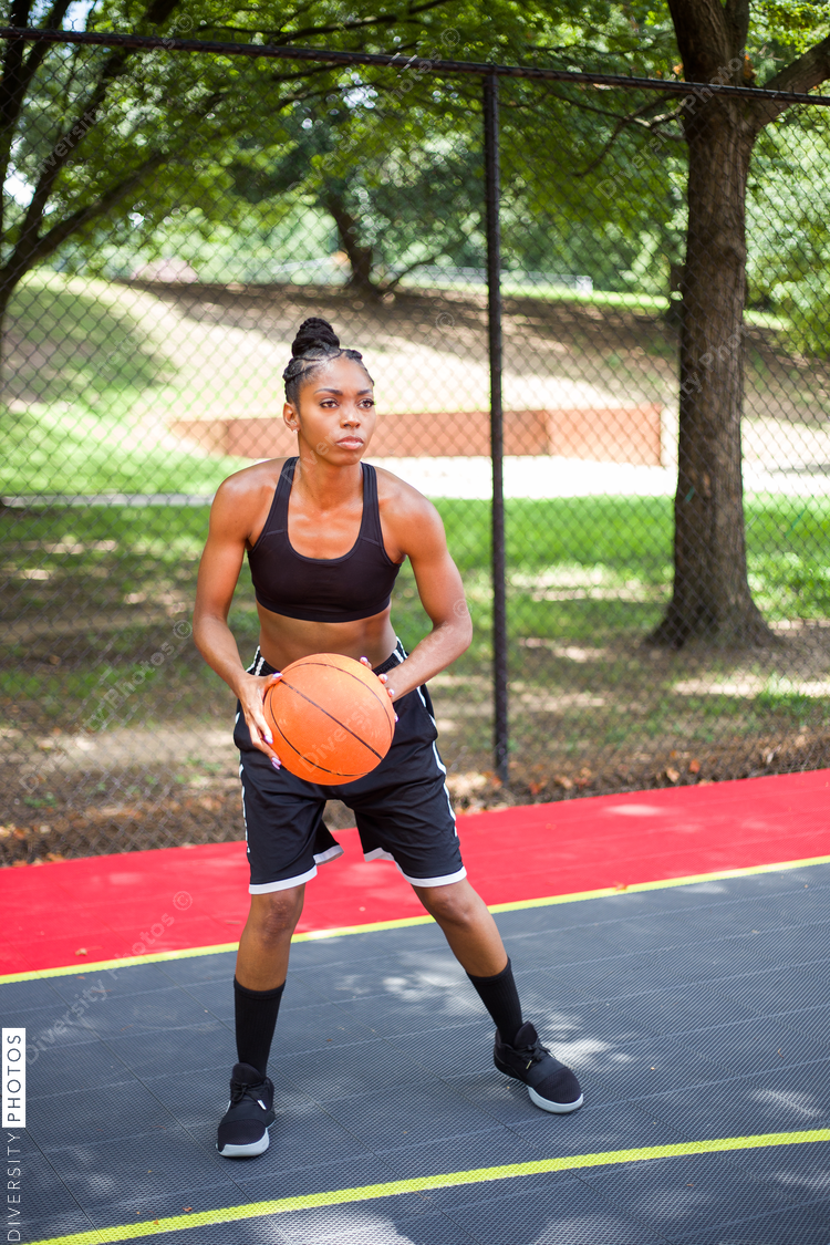 Woman gets ready to throw basketball
