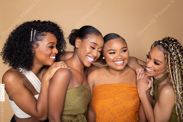 Studio portrait of four beautiful black female friends