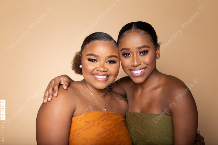 Female happy best friends studio portrait
