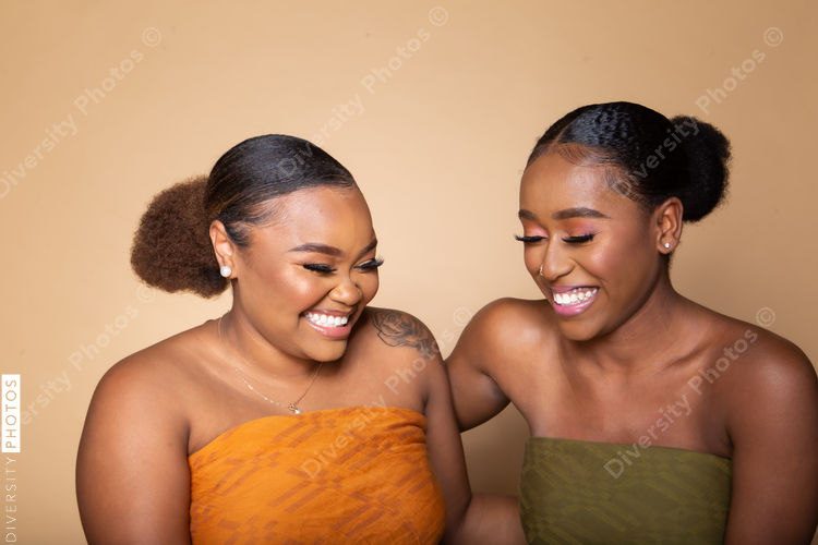 Female happy best friends studio portrait