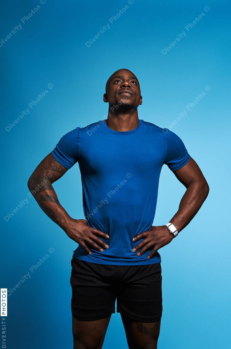 Athletic man looking up with copy-space