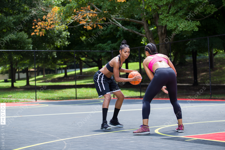 Women playing basketball