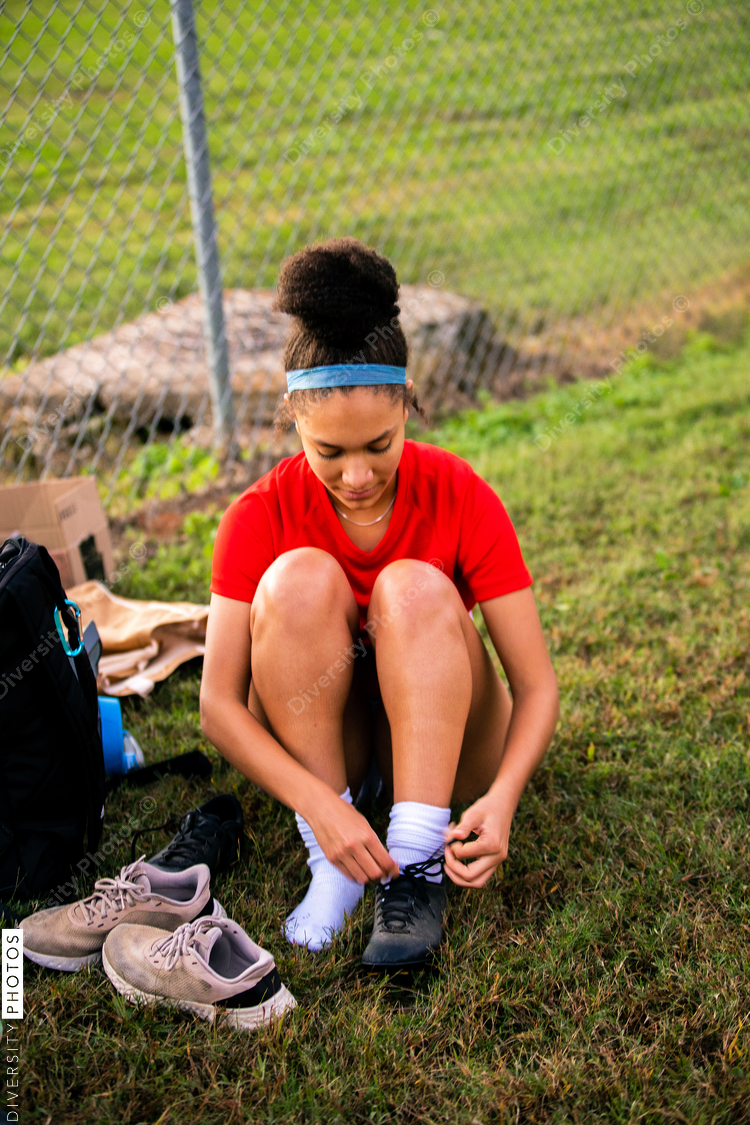 Girl packing up after the soccer game