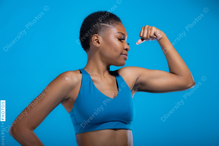 Portrait of fit African American woman in fitness wear with copy-space
