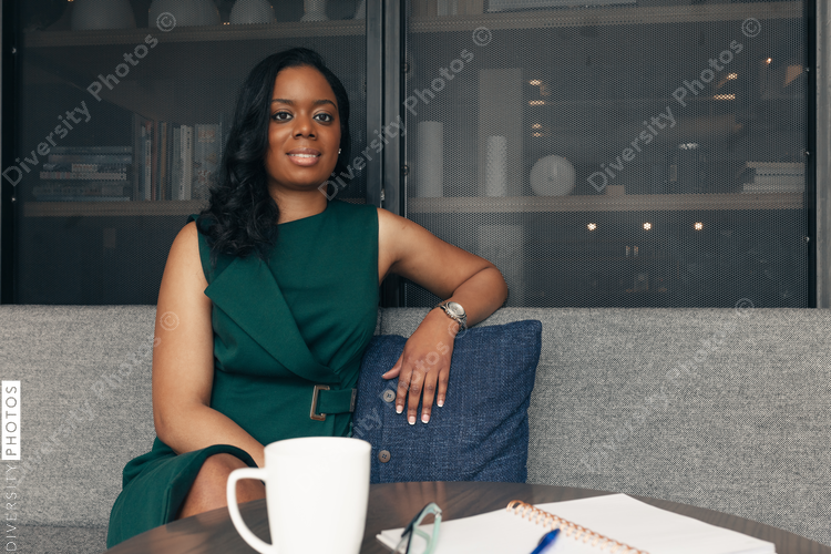 Relaxed businesswoman sits on sofa