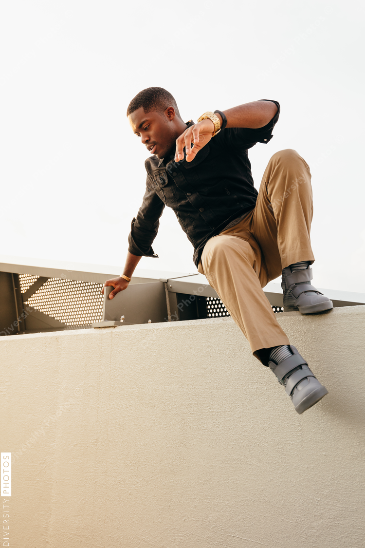 Man trying to jump on bridge