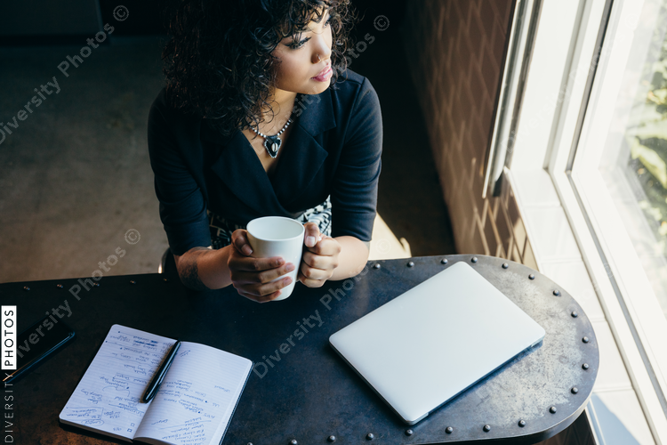 Directly above view of young businesswoman looking through window