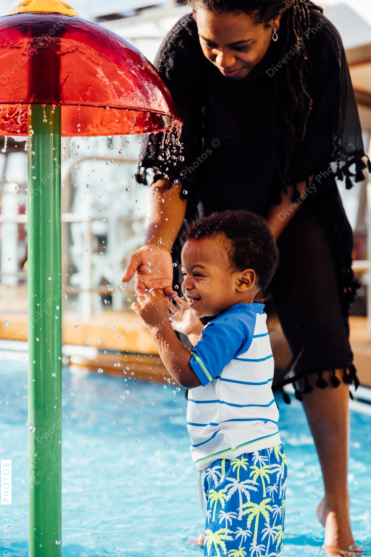 Young toddler playing in pool