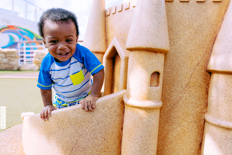 Young boy plays in park