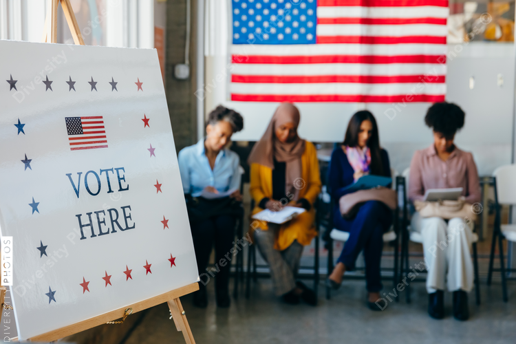 Diverse Voters Filling Out Registration Forms
