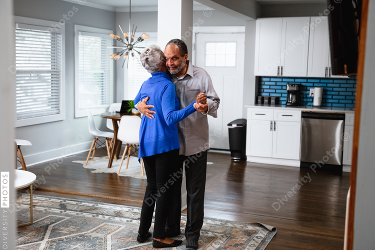 Active lifestyle, senior couple dances at home