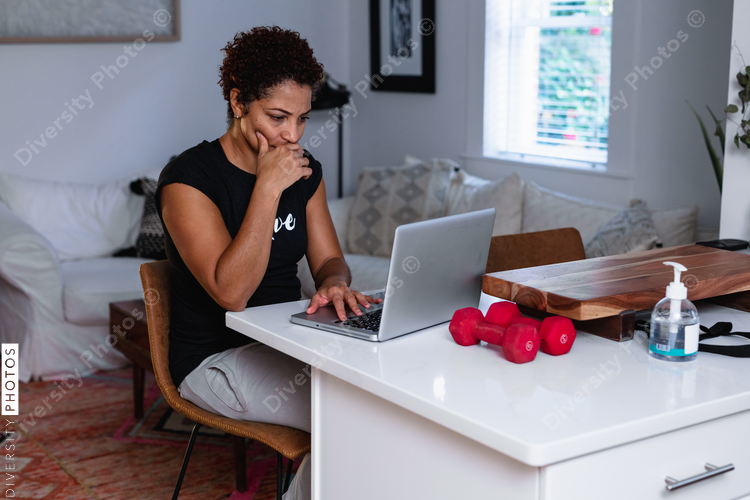 Professional Black woman working remotely from home, freelancer consultant