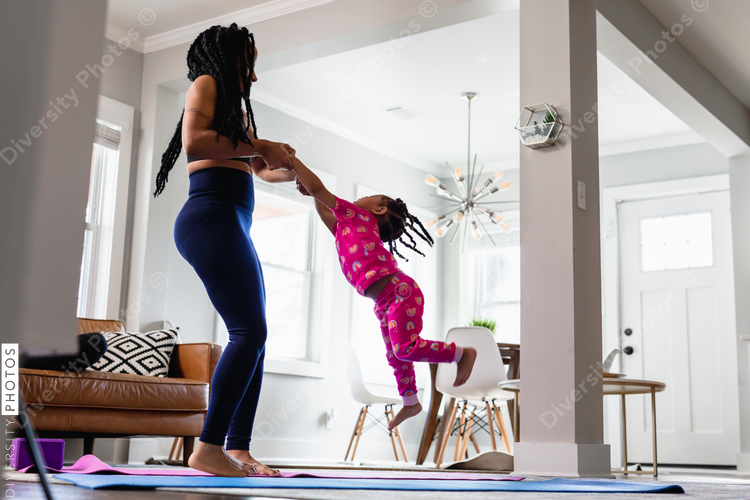 Mom and daughter playing in living room
