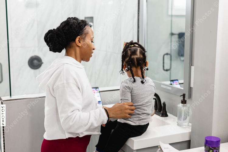 Black mother daughter morning routine