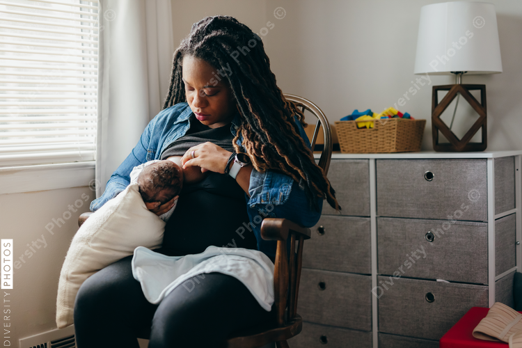 African American mother breastfeeding baby