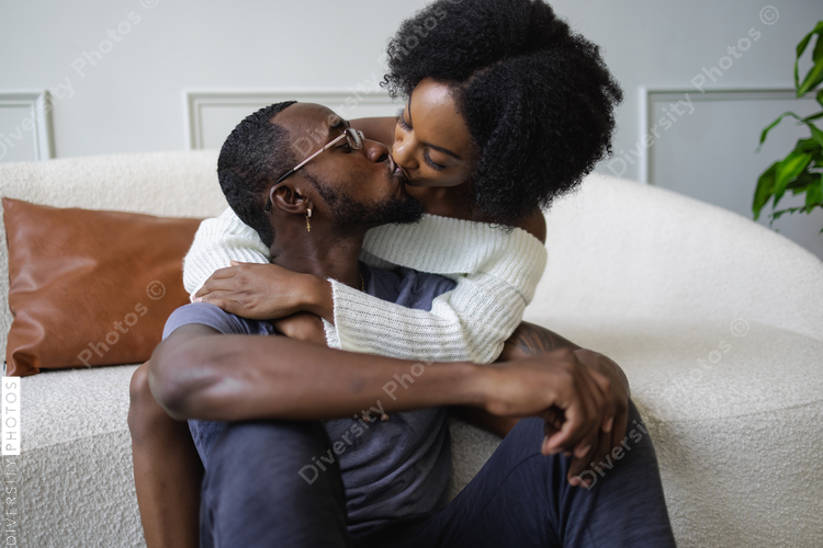 Young Couple kissing in living room