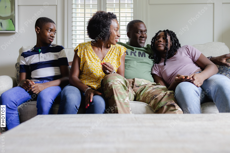African American family portrait at home on sofa
