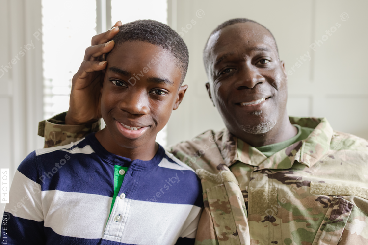Feeling happy dad is home, family is complete, African American military, father and son