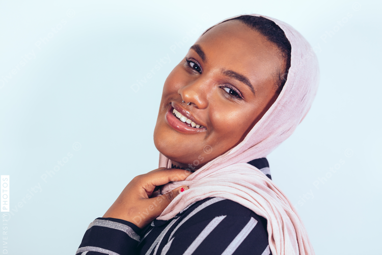 Portrait of young woman with nose ring and headscarf