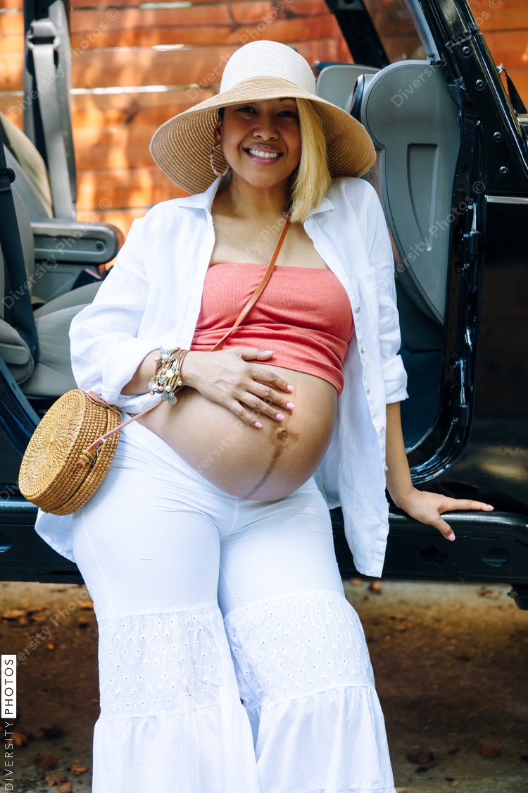 Beautiful pregnant woman in third trimester traveling