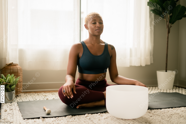 Black woman meditating at home