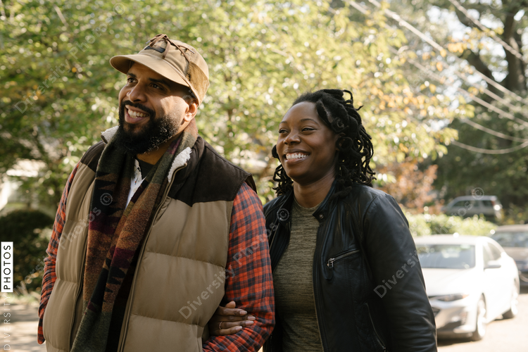 African American couple walking in neighborhood