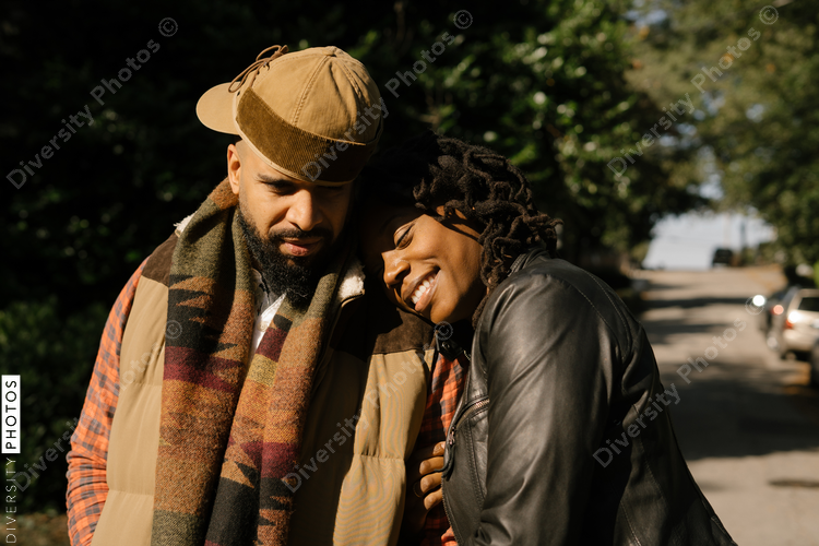 African American couple walking in neighborhood