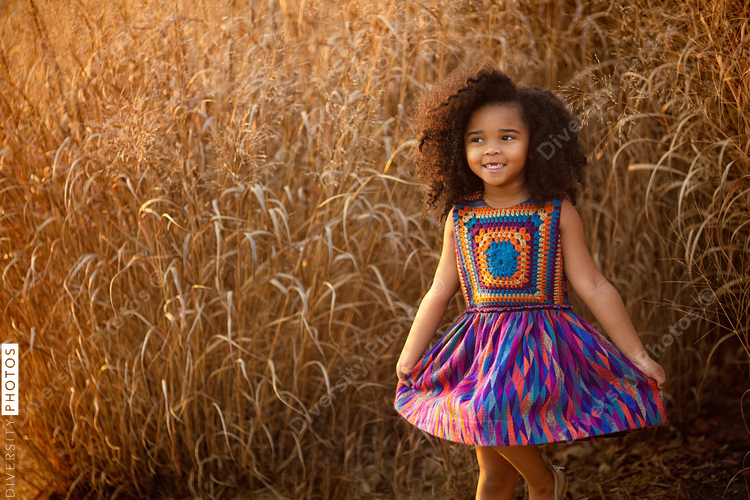 Smiling girl standing in field