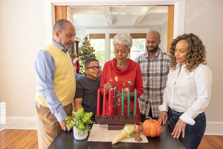 Multigenerational black family celebrating Kwanzaa together