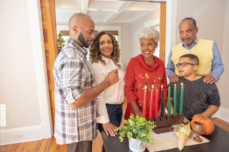 Multigenerational black family celebrating Kwanzaa together