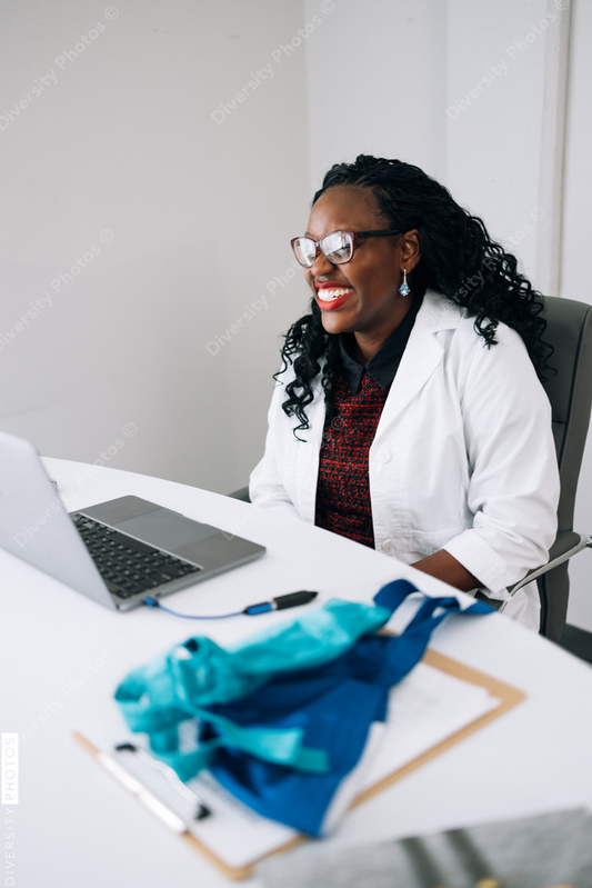 African American female Doctor does virtual patient consulation, telehealth