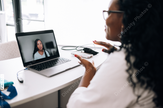African American female Doctor does virtual patient consulation, telehealth