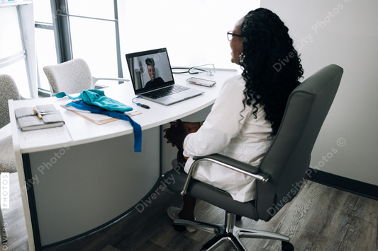 African American female Doctor does virtual patient consulation, telehealth