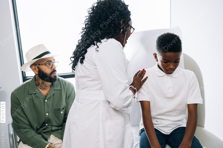 Black pediatrician does strength examination doctor patient consultation