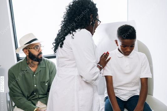 Black pediatrician does strength examination doctor patient consultation