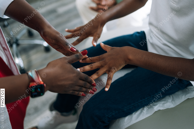 Black pediatrician does strength examination doctor patient consultation
