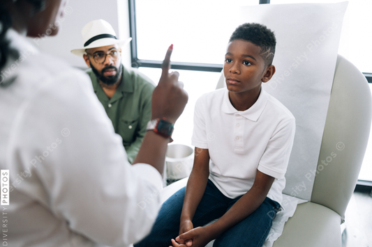 Black pediatrician does strength examination doctor patient consultation
