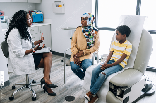Black pediatic doctor consults Muslim patients
