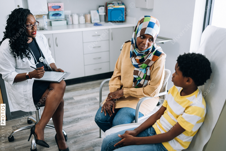 Black pediatic doctor consults Muslim patients