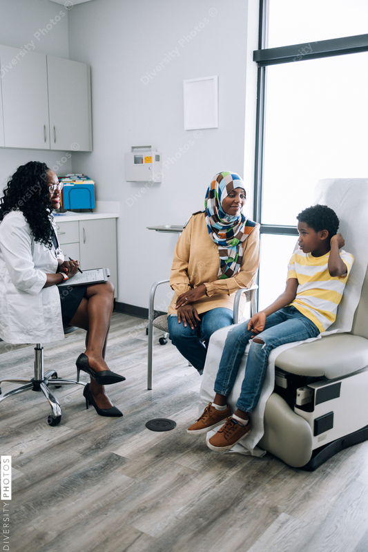 Black pediatic doctor consults Muslim patients