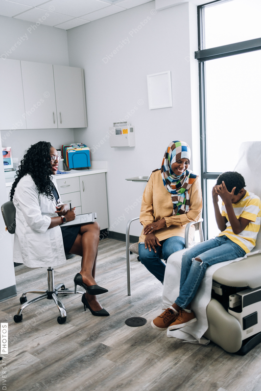 Black pediatic doctor consults Muslim patients