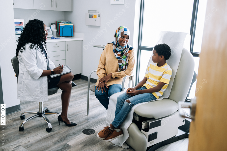 Black pediatic doctor consults Muslim patients