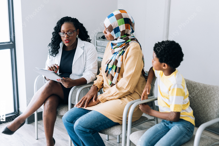 Doctor consulting African American patients